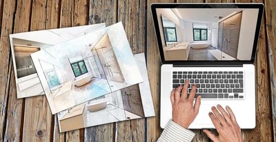 Auf einem Holztisch liegen Skizzen eines modernen Badezimmers, während eine Person am Laptop arbeitet.